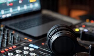 Podcast recording equipment including mixer and headphones